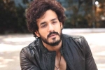 Nagarjuna and Akhil breaking updates, Nagarjuna 100th film news, nagarjuna s 100th film will have akhil in a crucial role, Nagarjuna 100th film